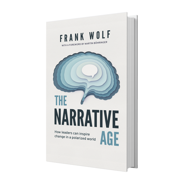 Stacks of Frank Wolf's book the Narrative Age at the VOICES Berlin event in April of 2024.